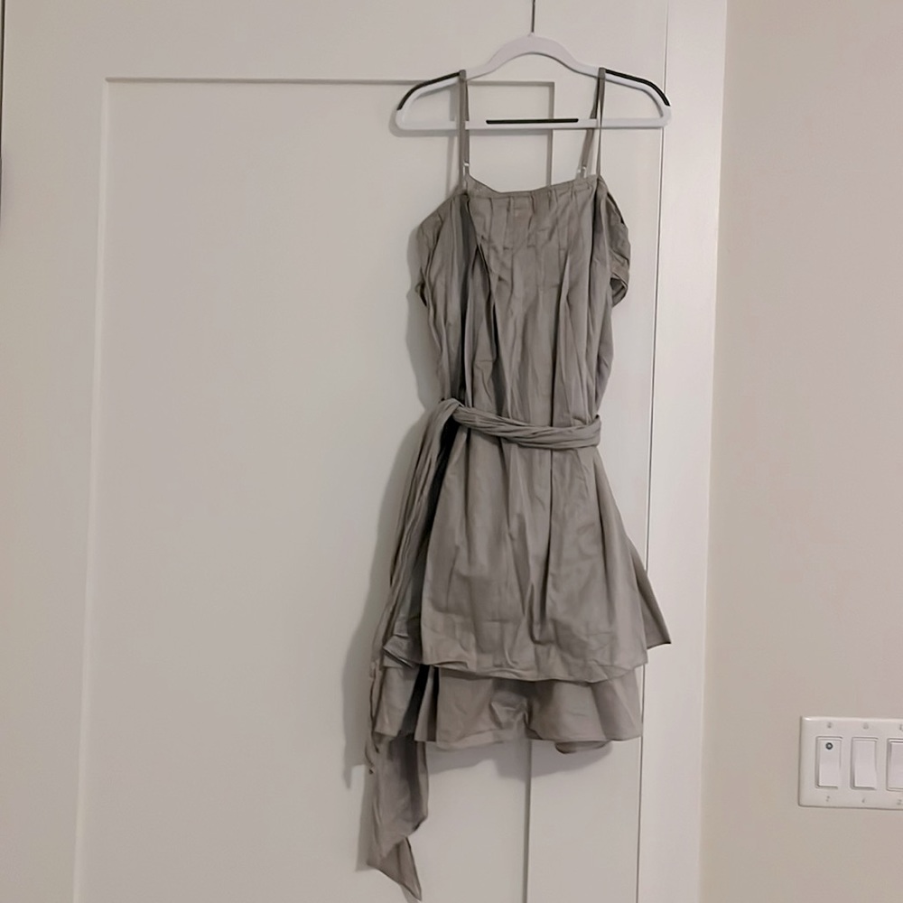 Strappy linen dress with a little bit of shimmer. Pleated bust. Ruffled skirt.